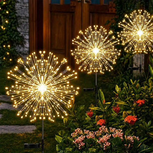 Starburst lights creating a beautiful firework effect in an outdoor garden at night
